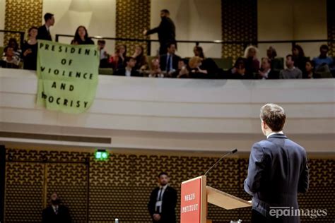 Protesters briefly interrupt Macron’s speech in Netherlands
